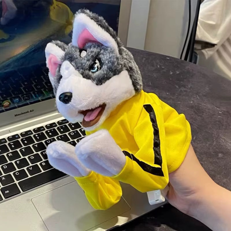 Husky boxing puppet held beside a laptop