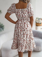 Back view of Meadow Muse White floral midi dress