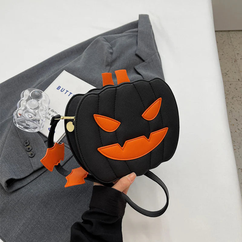 Spooky Black jack-o’-lantern purse with orange face details
