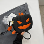 Spooky Black jack-o’-lantern purse with orange face details