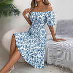 Meadow Muse Blue floral midi dress shown seated