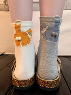 White and gray cat-pattern novelty socks shown together
