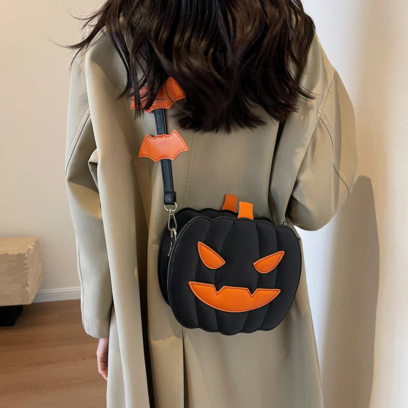 Spooky Black pumpkin purse worn with bat-detail strap