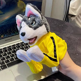 Husky boxing puppet held beside a laptop