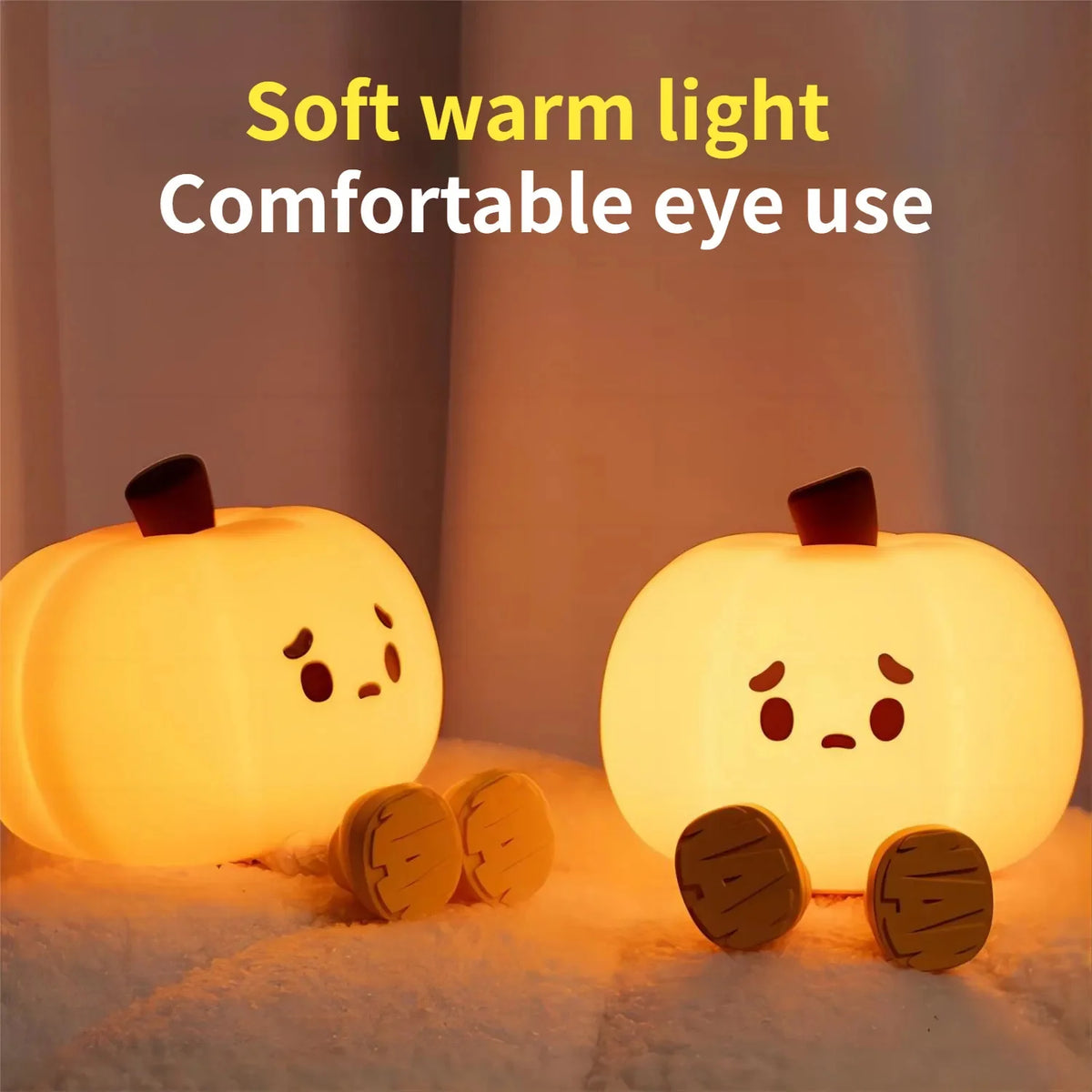 Two glowing pumpkin night lights illustrating the warm light