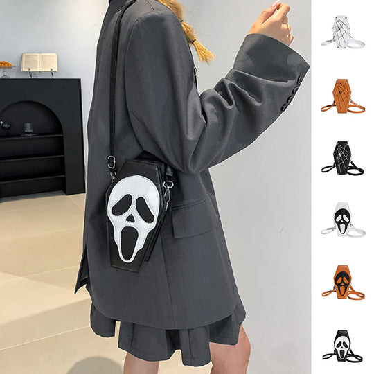 Black coffin purse with skull face worn over the shoulder