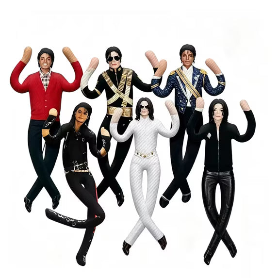 A set of six Michael Jackson-themed plush dolls or toys arranged together on a plain white background. The figures are dressed in various iconic Michael Jackson outfits, including the Red Album, Black Album, Thrasher, and White Album styles.