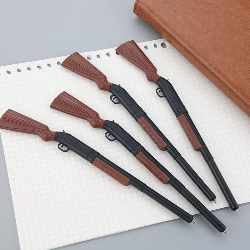 QuickDraw novelty pens arranged on a notebook