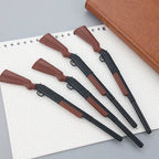 QuickDraw novelty pens arranged on a notebook