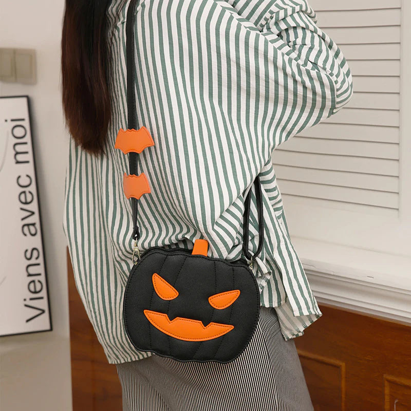 Spooky Black pumpkin purse worn as a shoulder bag