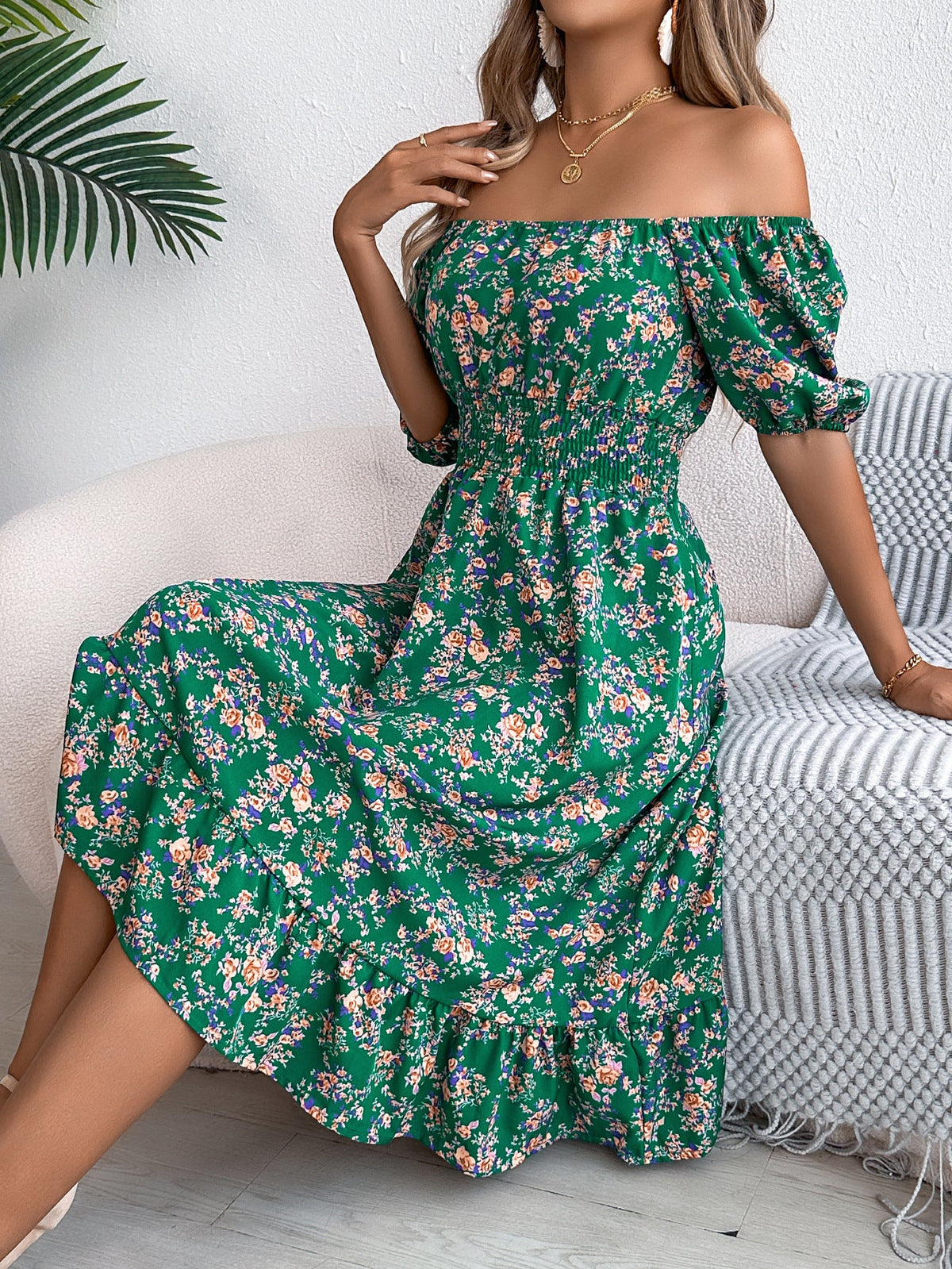 Meadow Muse Green floral midi dress shown seated