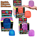 Gumdrop fidget toys in orange, blue and purple