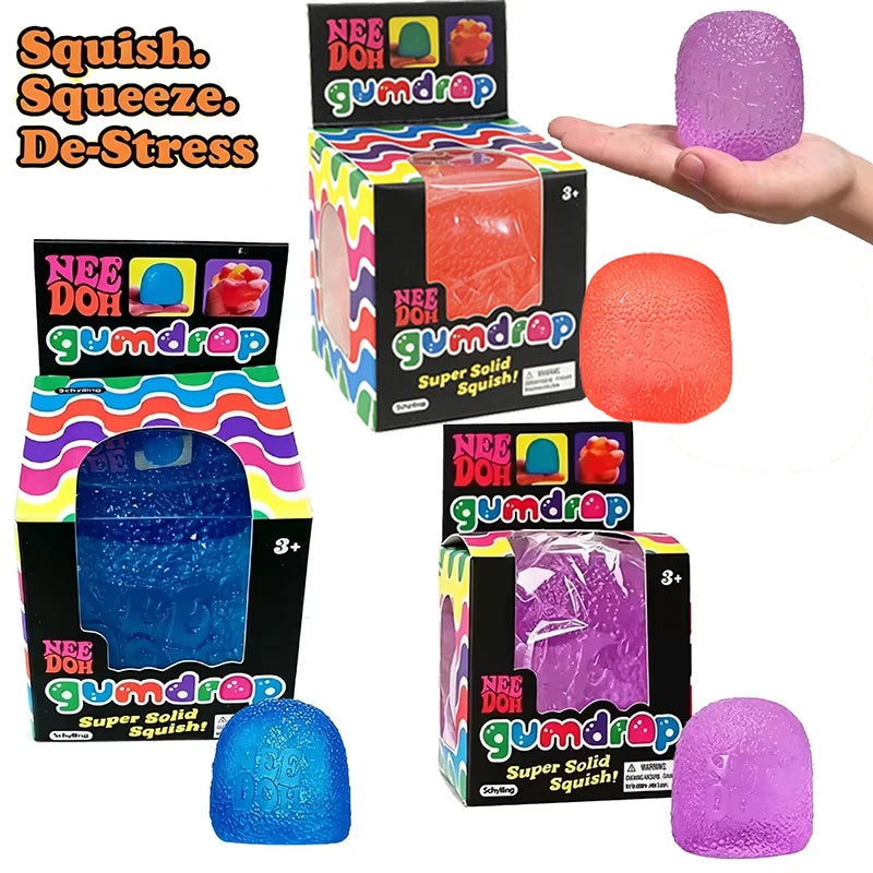 Gumdrop fidget toys in orange, blue and purple