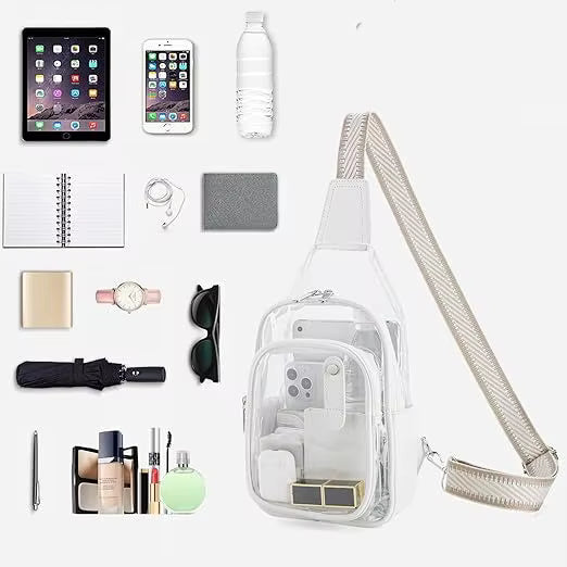A clear shoulder bag with a wide beige woven strap, shown on a light gray background surrounded by various travel accessories including a tablet, smartphone, water bottle, notebook, earbuds, wallet, sunglasses, watch, umbrella, and cosmetics.