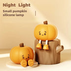 Pumpkin night light displayed on a wooden stand