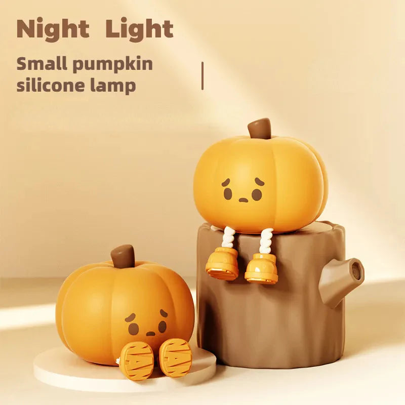 Pumpkin night light displayed on a wooden stand