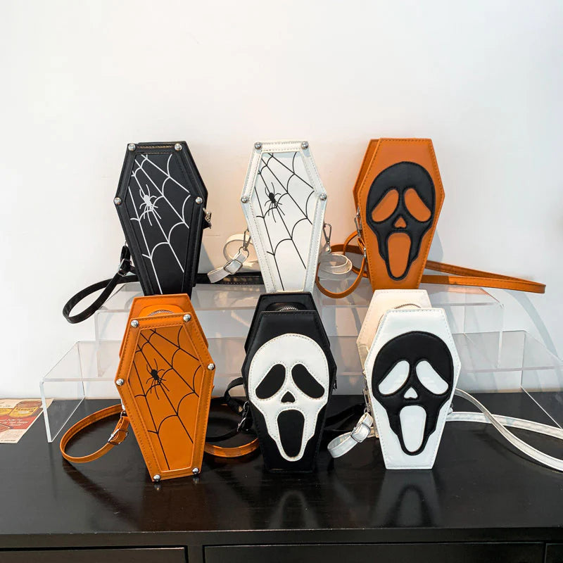 Six skull and spider-web coffin purse styles displayed together