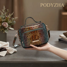 Deep blue crocodile-embossed structured satchel with gold-tone hardware