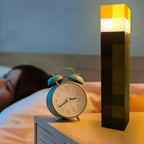 Pixel torch LED lamp on a bedside table