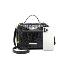 Glossy structured satchel handbag detail view