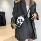 Black skull-face coffin purse styled with a dark outfit